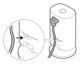 Illustration showing to secure the power cable with the base clip.
