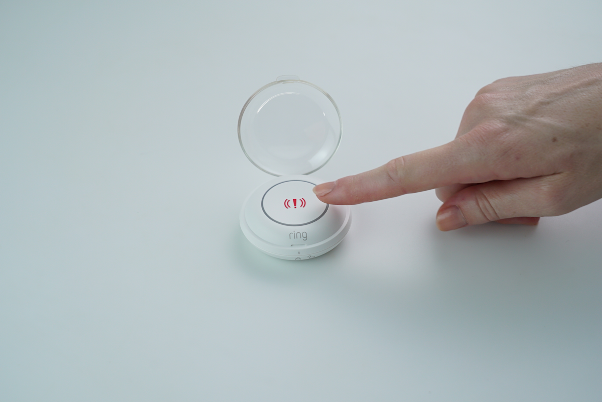 Ring Alarm Panic Button with the cover open ready for button press.