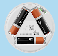 The back of Glass Break Sensor with the cover removed showing AA batteries arranged in a triangle with a QR code visible in the center.