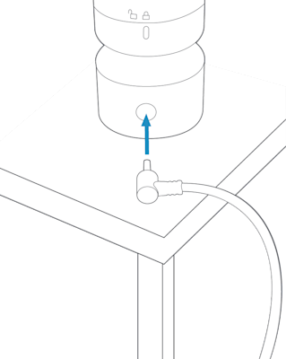 Plugging power cable into back of Outdoor Pan-Tilt Cam installed on a flat surface.
