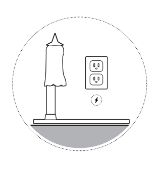 Illustration of a wall outlet with a lightning bolt icon below it and a Candy Cam mount and Outdoor Cam with a witch cover on it next to the outlet.