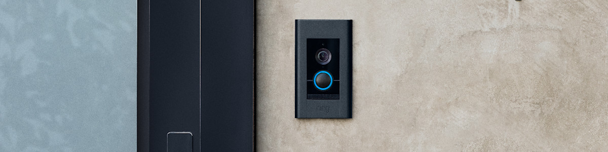 Ring Video Doorbell Elite connected through ethernet on a modern home's front door.