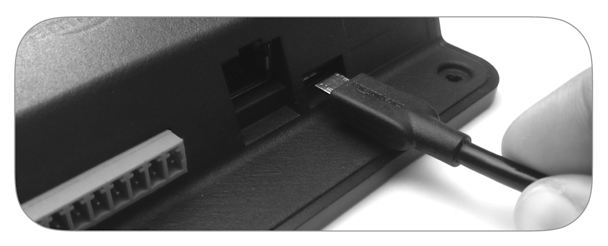 USB cable being plugged into electronic device port