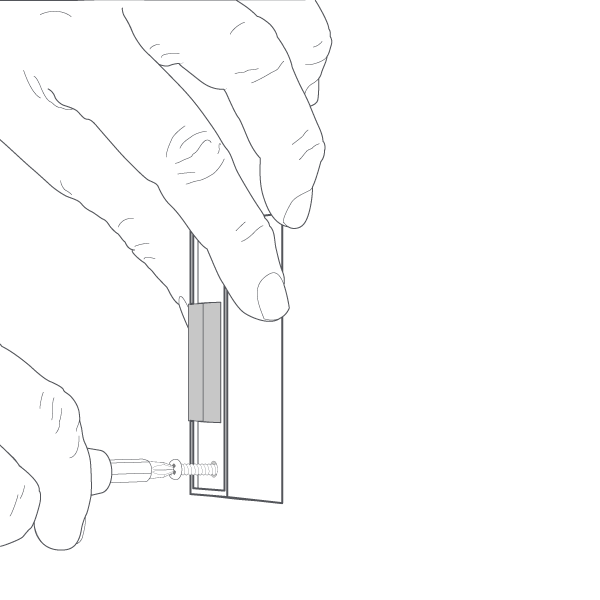 One hand holding doorbell and one hand holding a screwdriver and removing existing push-button doorbell.
