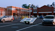 A Ring Mobile Security Tower, positioned in a parking area near a business.
