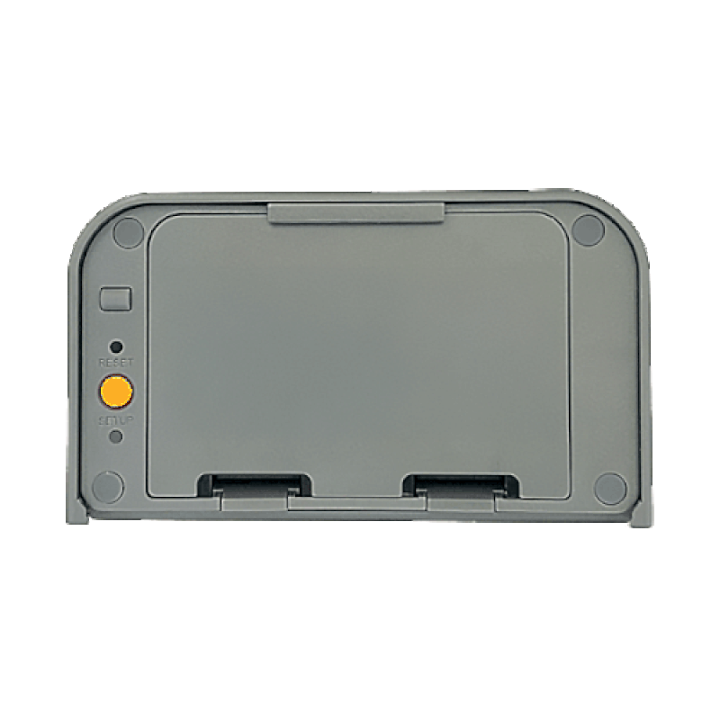 A gray rectangular contact sensor with a small green light under the word "setup" flashing once, below a yellow button.