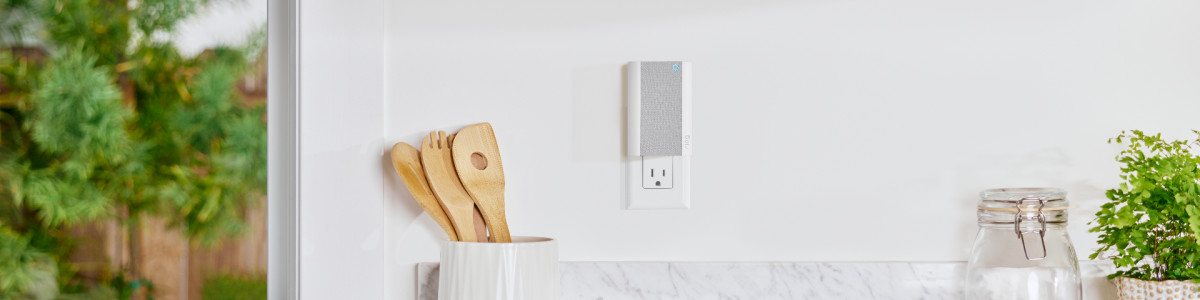 Ring Chime Pro (2nd Generation) plugged into a wall in a modern kitchen.
