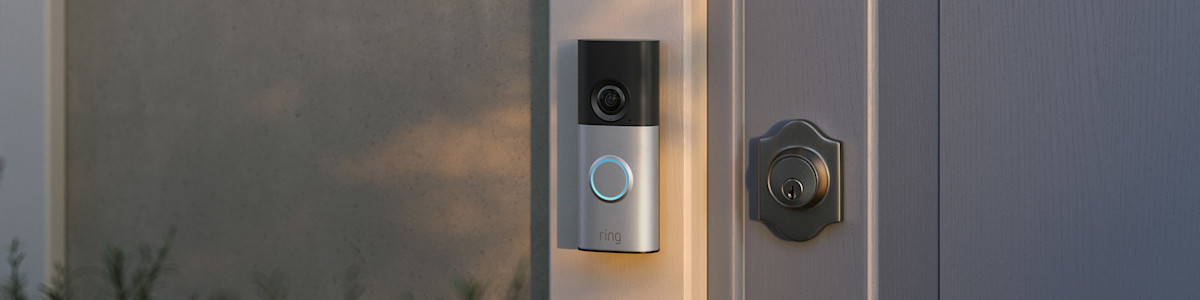 Wired Doorbell Plus (2nd Gen) mounted next to traditional door lock