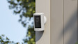 Article Header Image showing Outdoor Cam (2nd Gen) installed on the exterior of a modern home.