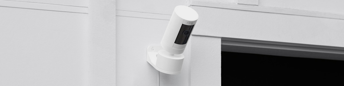 White Ring security camera mounted on exterior wall with the Pant-Tilt Mount.