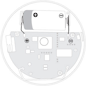 The inside of a Panic Button showing the battery at the top with the plus on the left and the minus on the right. 