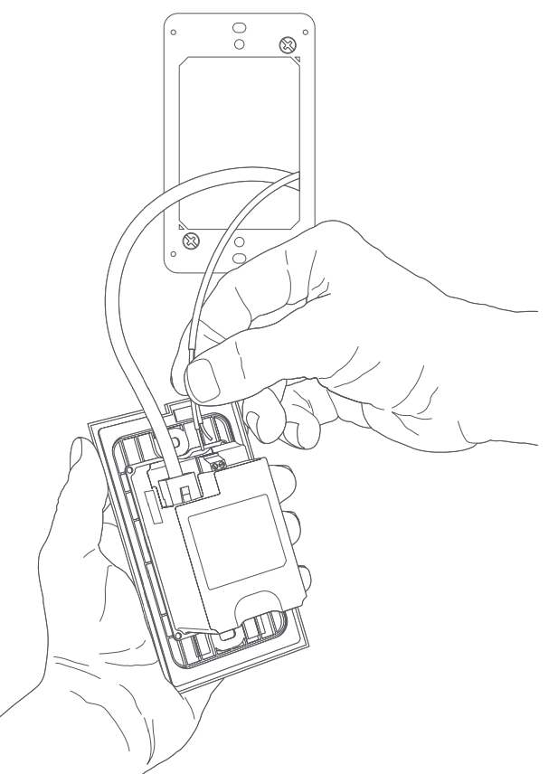 Illustration of a hand holding a doorbell with a connected Ethernet cable facing up and the other hand attaching a wire to the connector to the right.