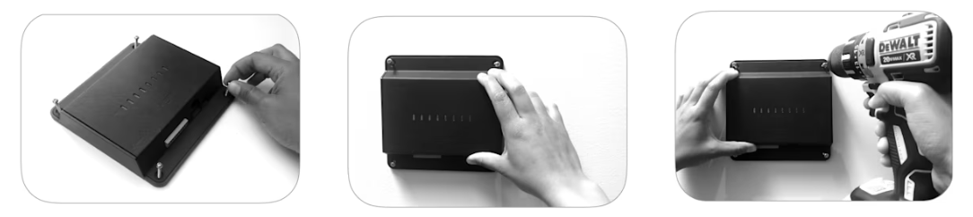 Access Controller Pro with a hand placing the screws, holding the device on a wall, and using a power drill to secure it to the wall.