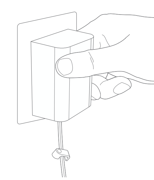 Inserting plug-in adapter into wall outlet.