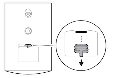 The protective rubber cap being pulled from the power port located on the back of the device near the bottom.