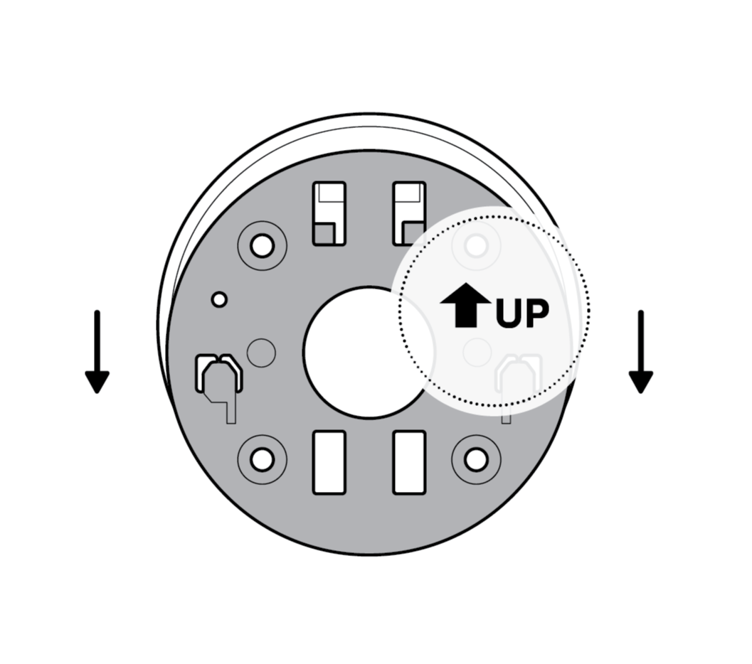 A gray camera mounting plate with a white circle behind it and an arrow pointing up on it and two arrows pointing down next to it showing to slide it off.