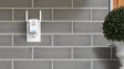 Ring Chime Pro (1st Generation) plugged into a backsplash wall in a modern kitchen