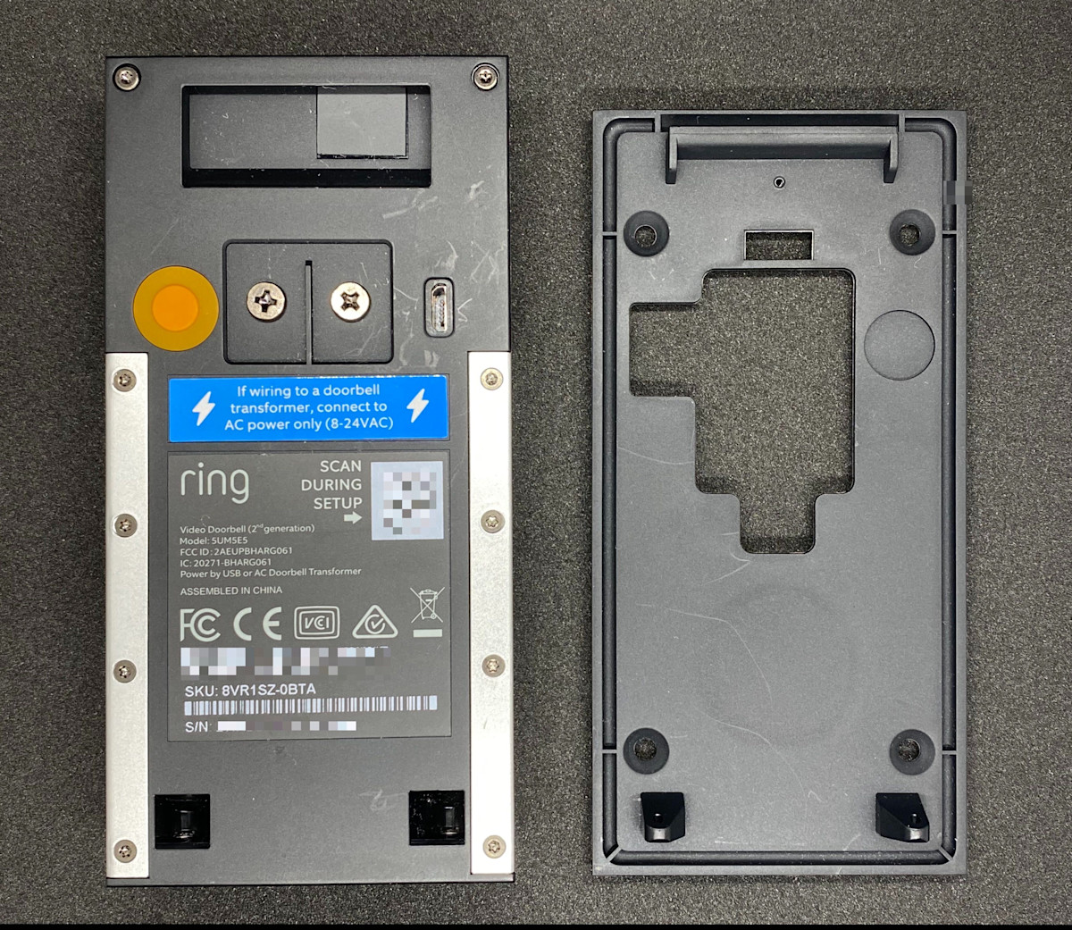 Video Doorbell (2nd Gen) mounting plate and back of device showing the orange setup button.