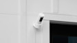 White Ring security camera mounted on exterior wall with the Pant-Tilt Mount.