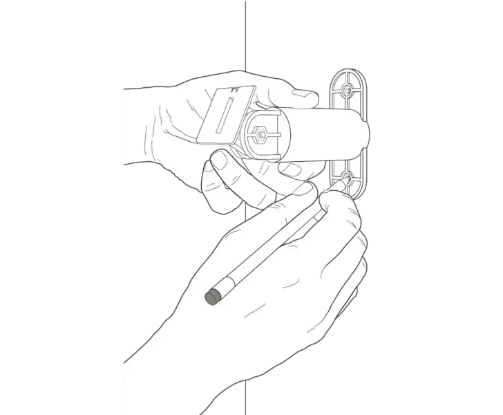 Illustration of a hand holding a mounting arm on a wall and using it as a template to mark the holes for installation. with a pencil.