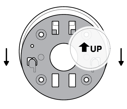 Illustration to show sliding the mounting plate in the direction opposite the up arrow to remove it.
