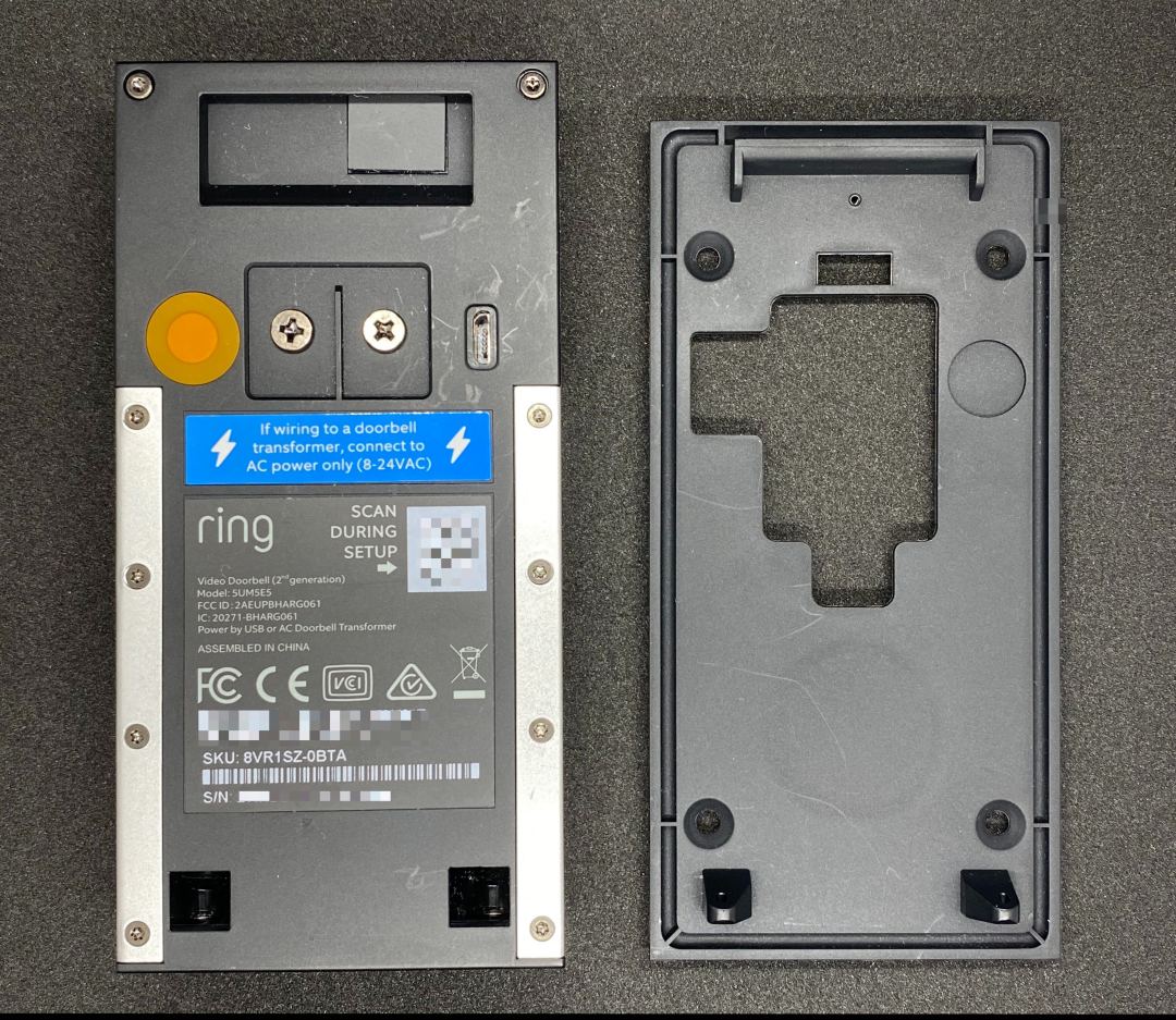 Image of Ring Video Doorbell (2nd Gen) device and a mounting plate. 