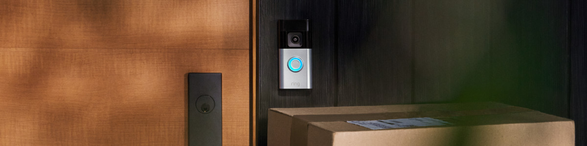 Ring video doorbell on the front door of a modern home.