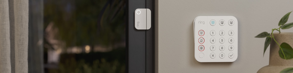 A Ring Alarm Contact Sensor protecting a sliding glass door inside a modern home